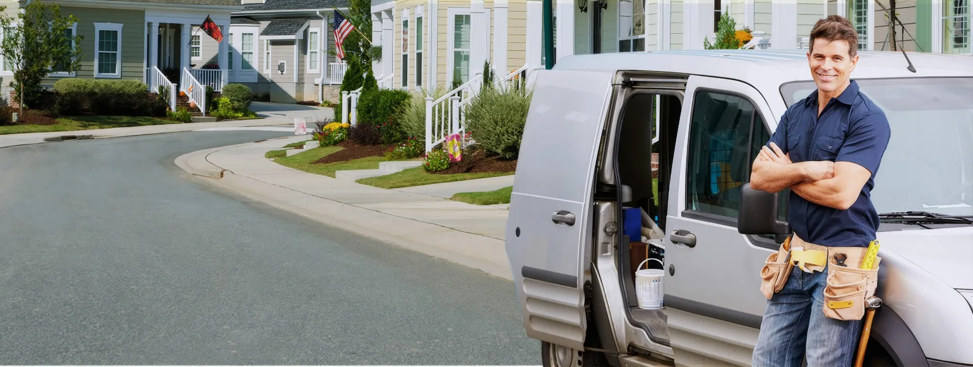 TrustPro Appliance technician beside a service van in a residential neighborhood